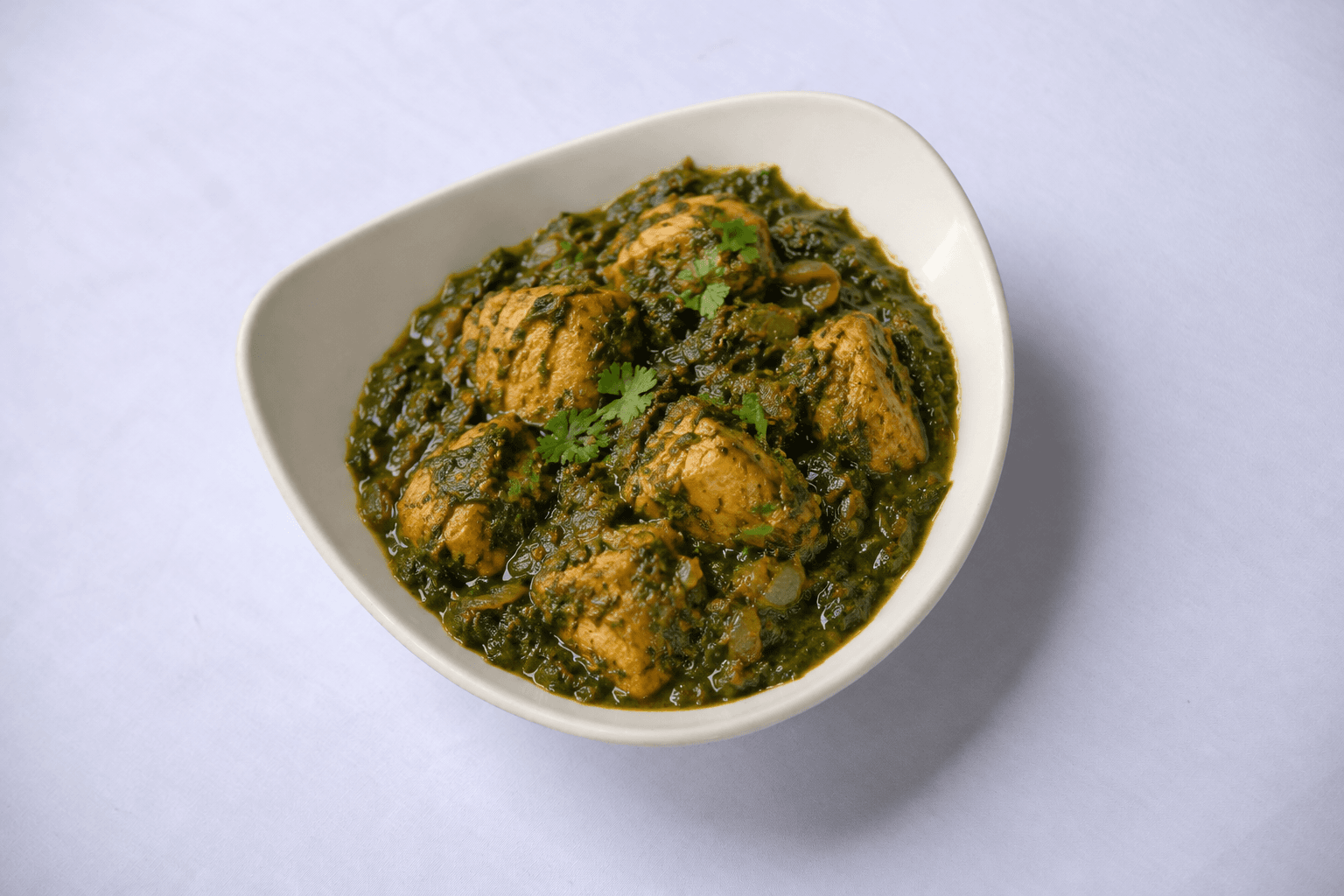 Chicken Saag Masala, served at India Oven Sacramento